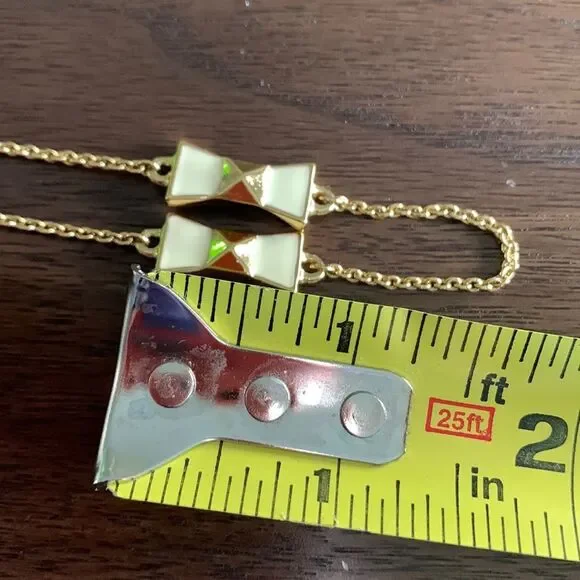 KATE Spade enamel/gold bow gold tone chain necklace